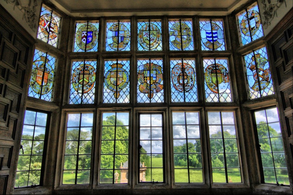 Stained_glass_window_overlooking_gardens_of_Montacute_House_4675709559