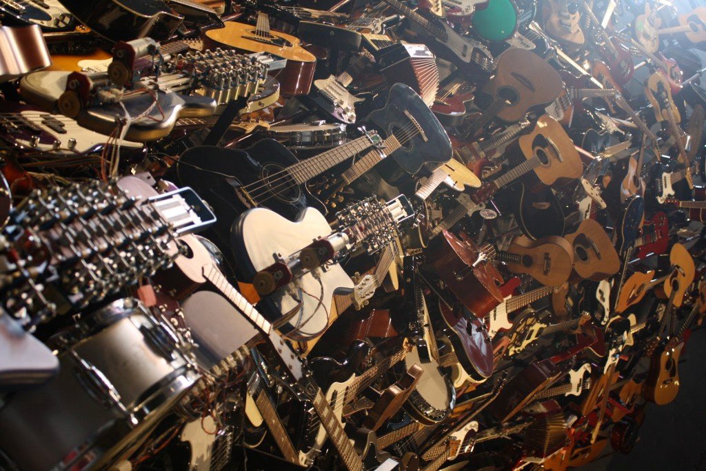 huge-pile-of-guitars